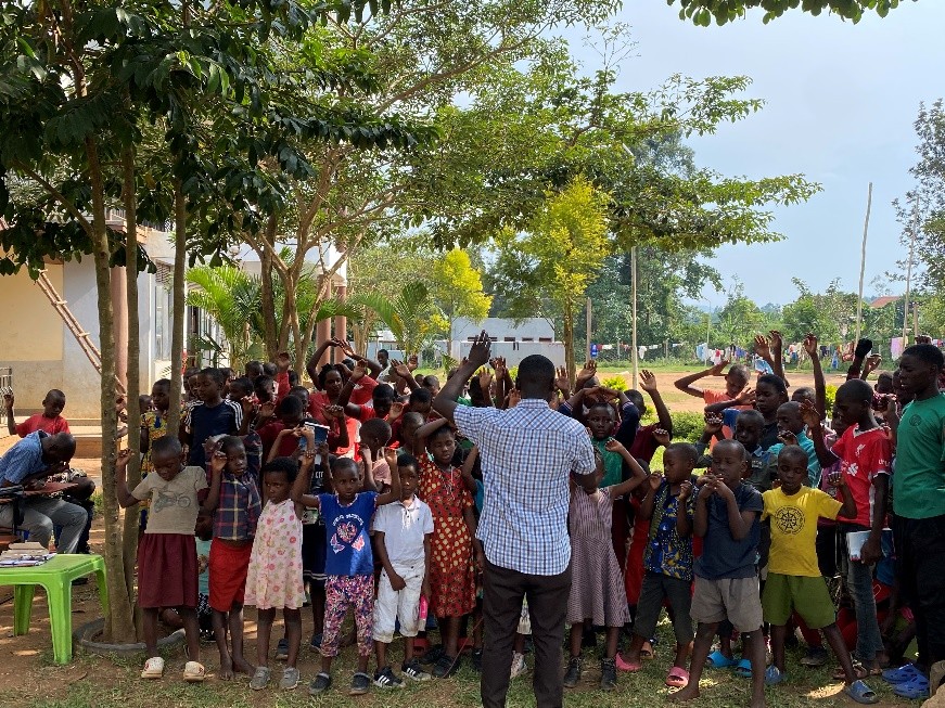Pastor Raymond Kateregga with the children at Abba Care Foundation, Uganda