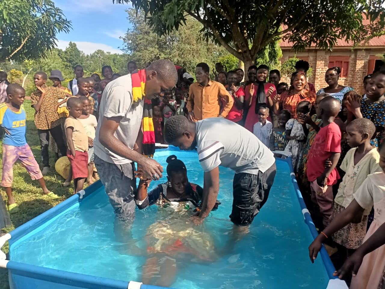 Apostle David Nsoni baptizing new believers after the Bugiri Crusade in Uganda