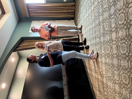 Anusha Daniel with board members Leslie and Patrick Muscolo singing and preaching at a local senior event