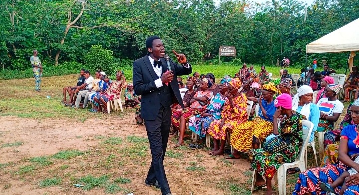 Evangelist Emmanuel Olukotun preaching the gospel at a joint medical camp
